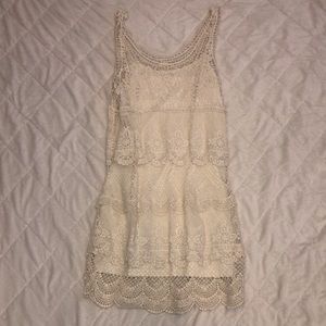 Gently used American Eagle cream lace dress size Med. Adjustable inside camisole